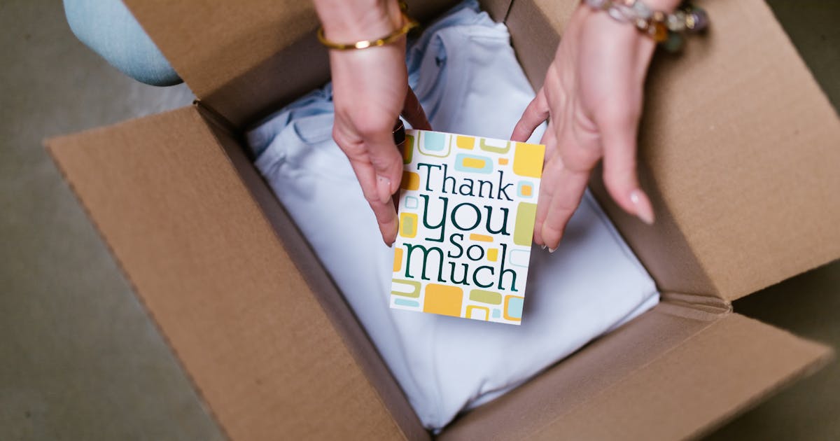 a person selling on Amazon or Etsy packing a box while thinking about the types of insurance they need - Photo by RDNE Stock project httpswww.pexels.comphotohealthy-marketing-people-connection-7310245