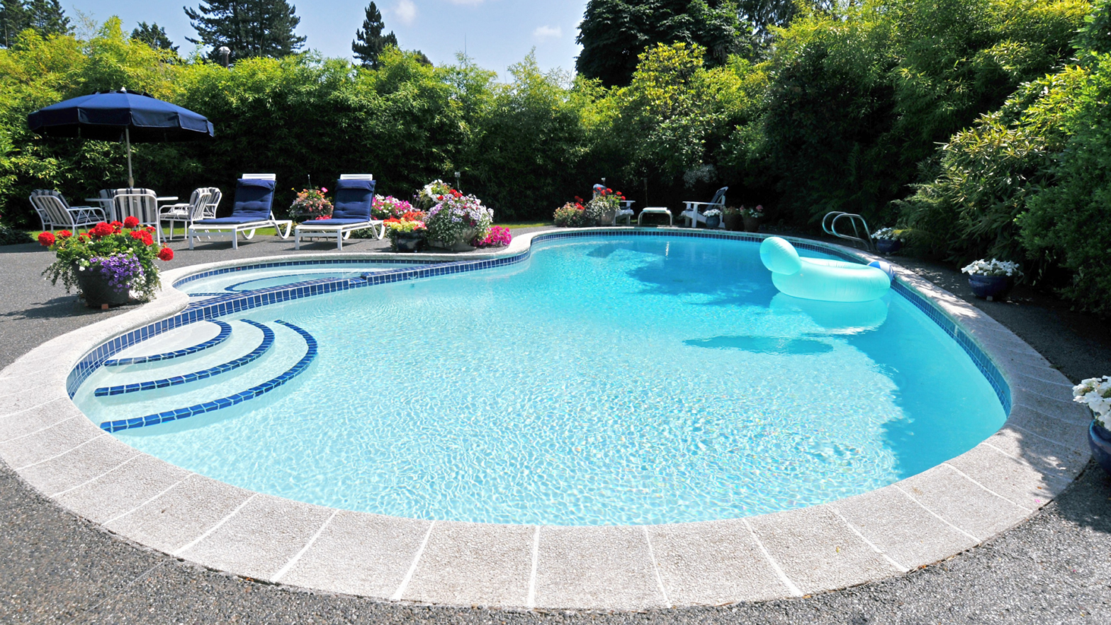 a pool in the backyard of home with proper insurance