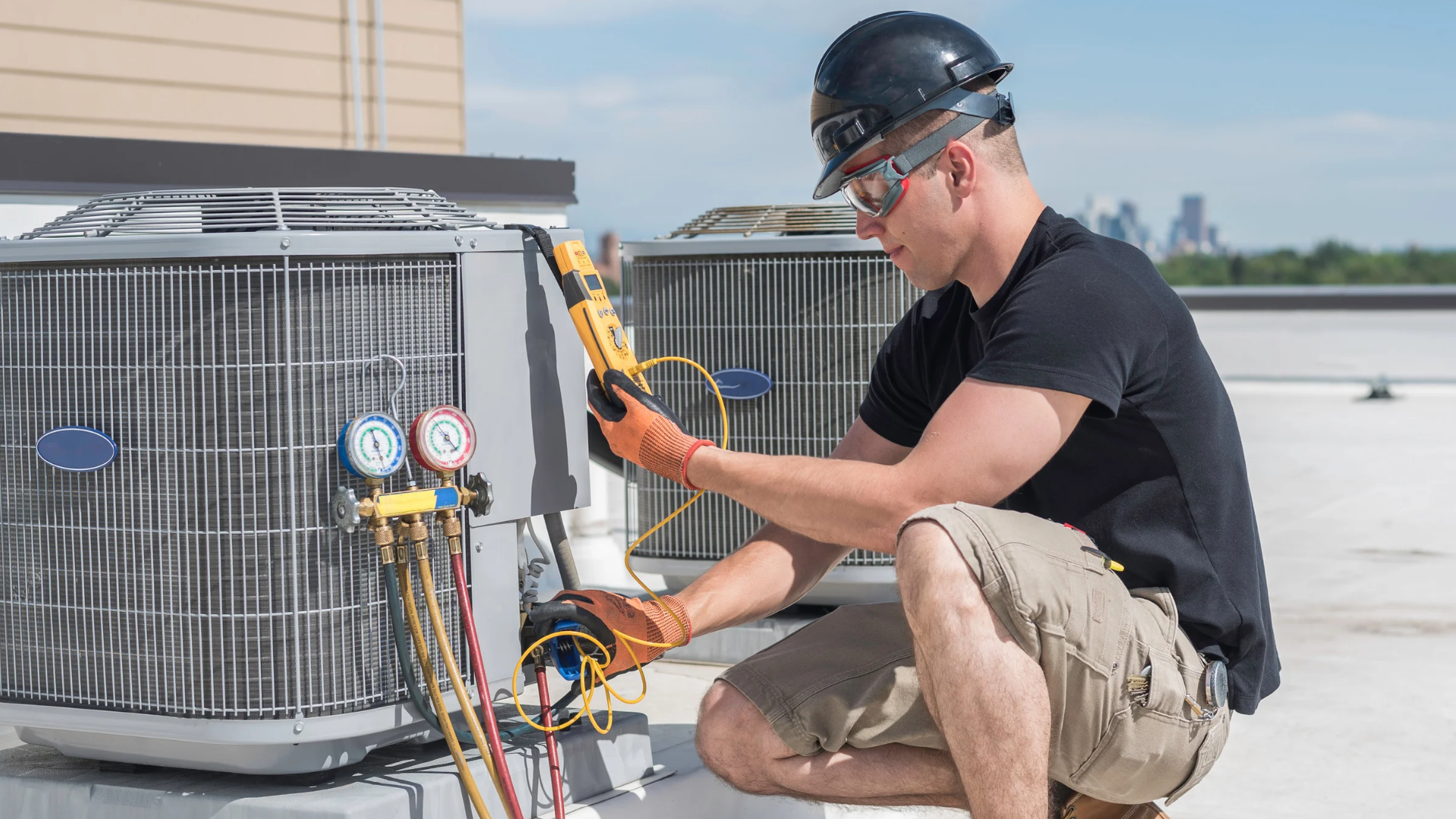 an HVAC technician working on equipment after securing the right insurance policies.